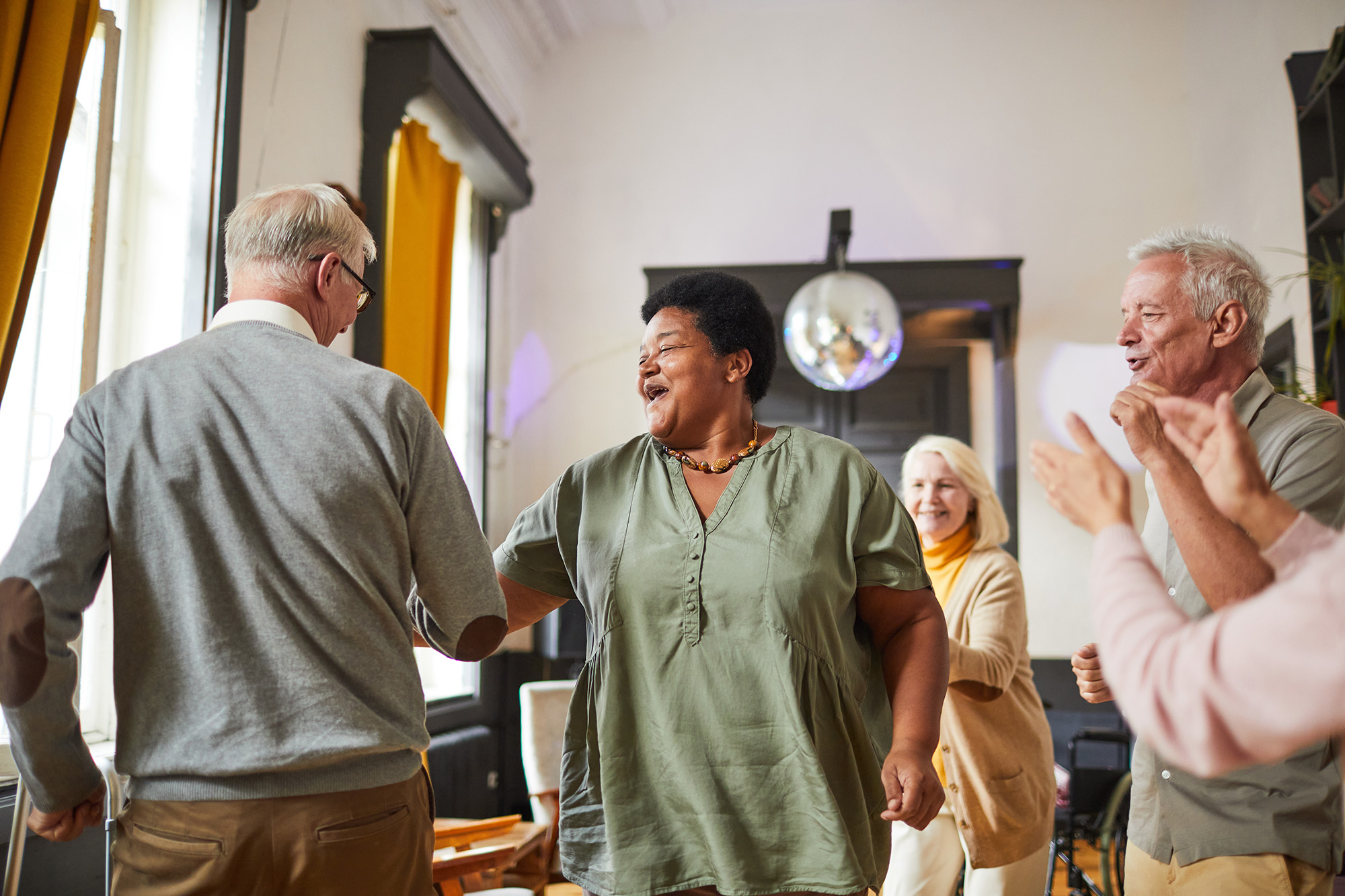 Senior People Dancing in Nursing Home Expansion Project Cottage